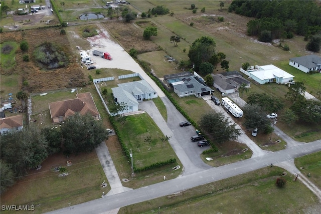 birds eye view of property with a rural view