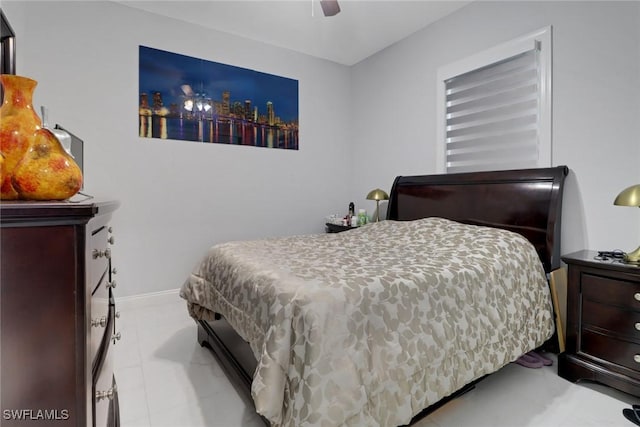 bedroom featuring ceiling fan and baseboards