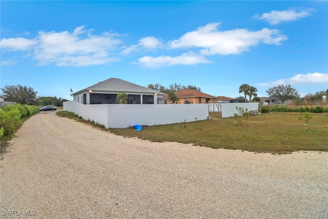 view of property exterior with a lawn