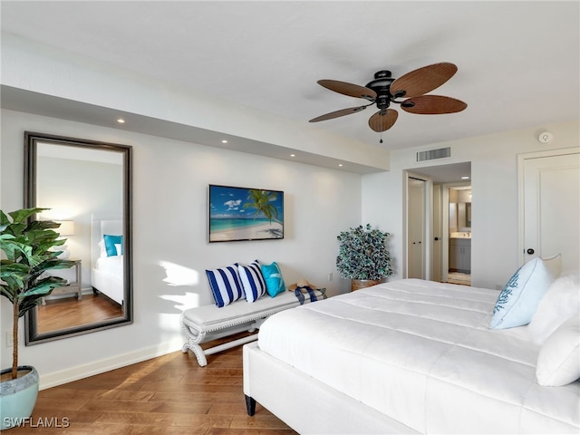 bedroom featuring baseboards, visible vents, dark wood finished floors, connected bathroom, and recessed lighting