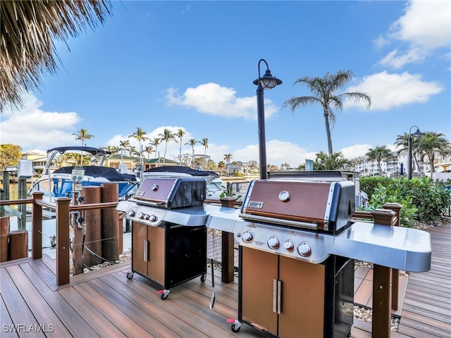 wooden terrace with a grill