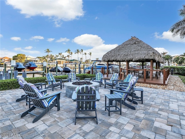 view of patio featuring a gazebo and an outdoor fire pit