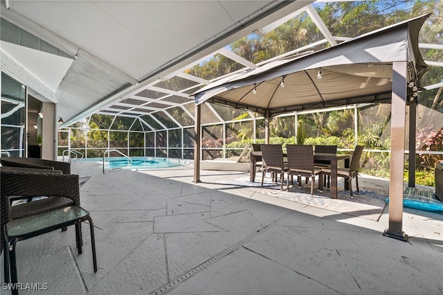 view of swimming pool featuring a patio and glass enclosure