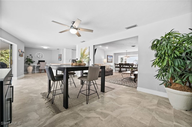 dining room with ceiling fan