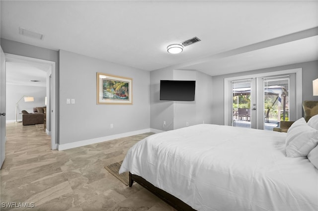 bedroom featuring access to outside and french doors