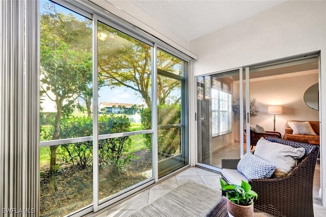 doorway to outside featuring tile patterned flooring