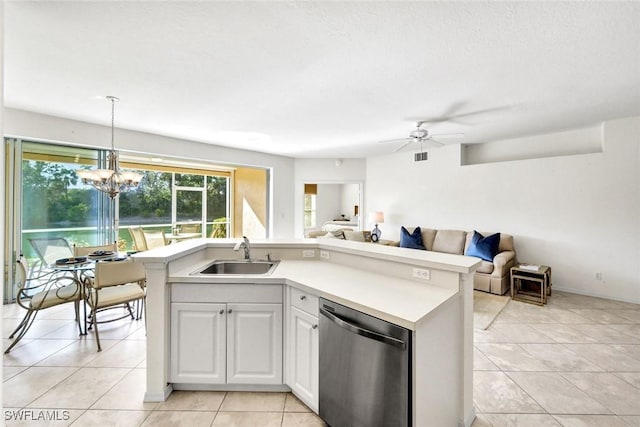 kitchen with a sink, open floor plan, stainless steel dishwasher, and light countertops