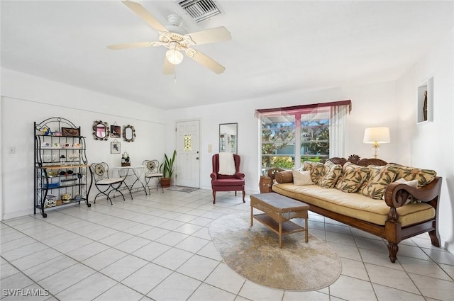 living room featuring light tile patterned flooring and ceiling fan