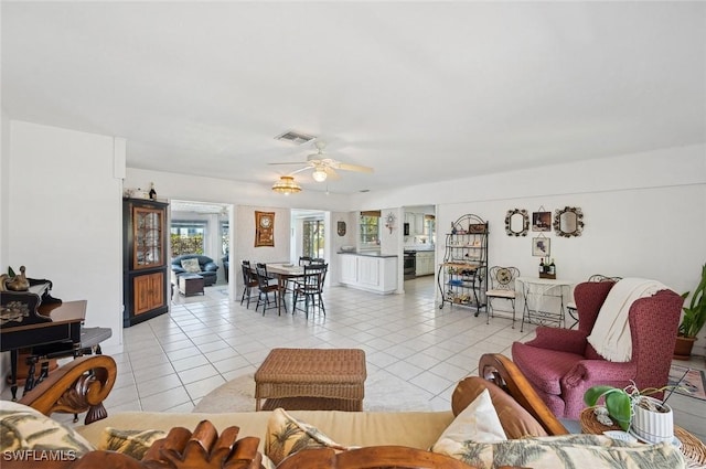 tiled living room featuring ceiling fan