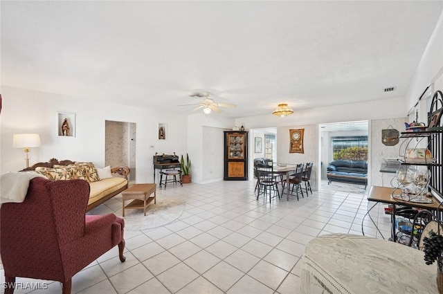 tiled living room featuring ceiling fan