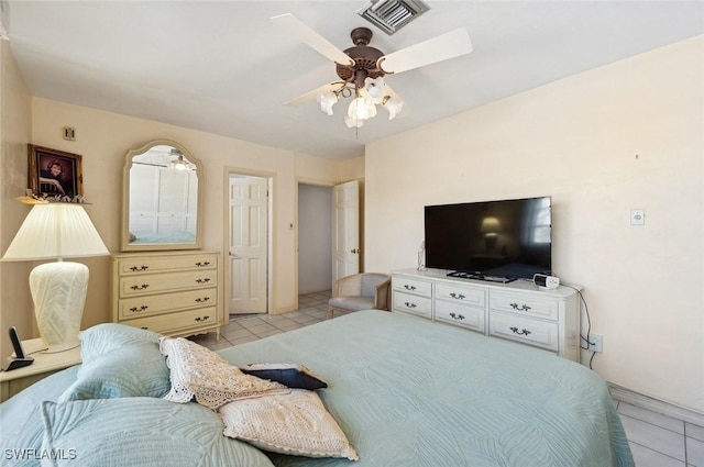 bedroom with light tile patterned floors and ceiling fan