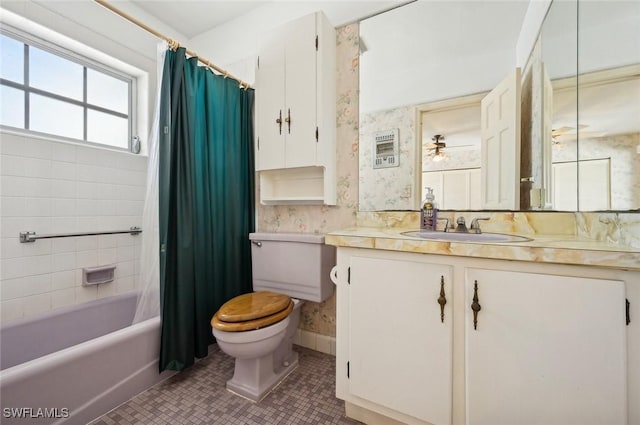 full bathroom featuring tile patterned floors, toilet, vanity, and shower / bath combo