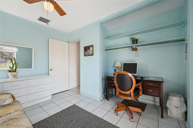 office space featuring ceiling fan and light tile patterned floors