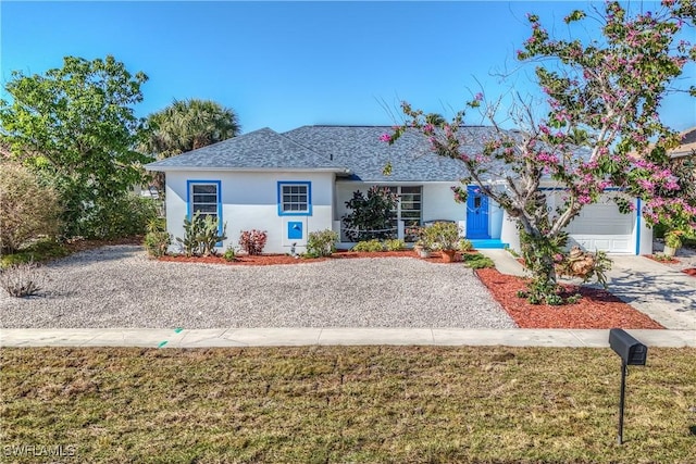 840 Wintergreen Ct, Marco Island, FL 34145 - ranch-style house with a garage and a front lawn