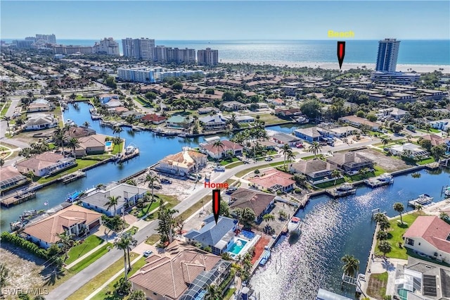 birds eye view of property featuring a water view