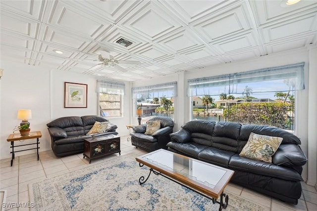 tiled living room featuring ceiling fan