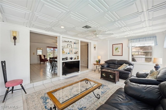 tiled living room with ceiling fan