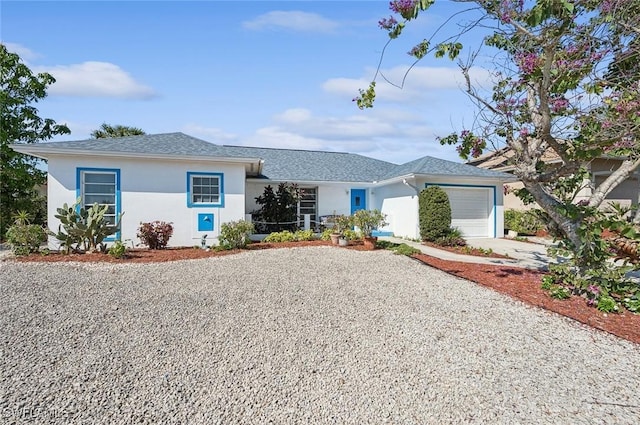 ranch-style home with a garage