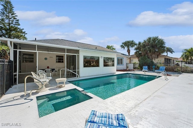 view of pool with a patio, a sunroom, and central air condition unit