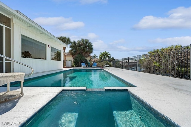 view of swimming pool featuring a patio area