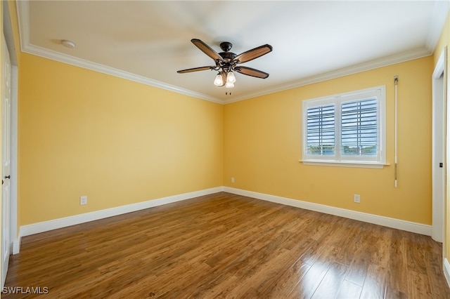 2534 Verdmont Ct, Cape Coral, FL 33991 - empty room featuring a ceiling fan, baseboards, wood finished floors, and ornamental molding