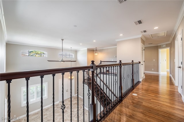 2534 Verdmont Ct, Cape Coral, FL 33991 - corridor with ornamental molding, visible vents, and wood finished floors