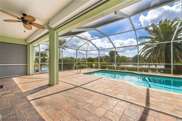 2534 Verdmont Ct, Cape Coral, FL 33991 - outdoor pool with a lanai, a patio area, ceiling fan, and a water view