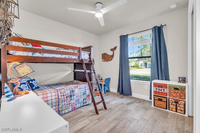 bedroom featuring light hardwood / wood-style flooring and ceiling fan