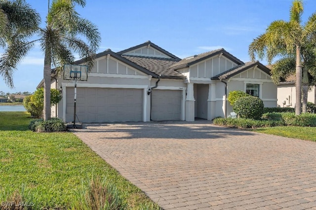 view of front facade featuring a garage and a front lawn