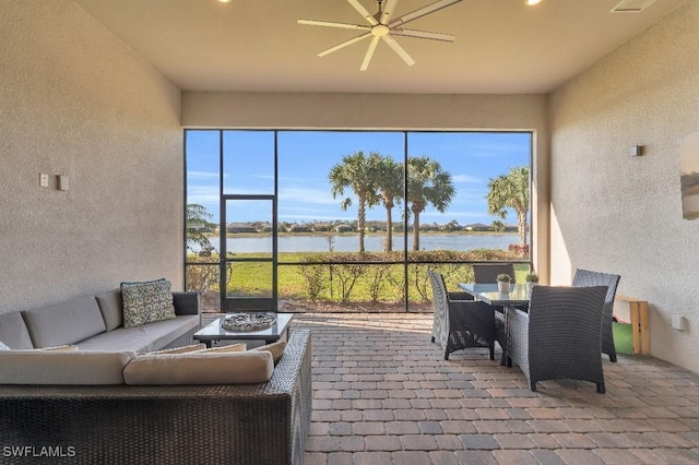 sunroom with a water view