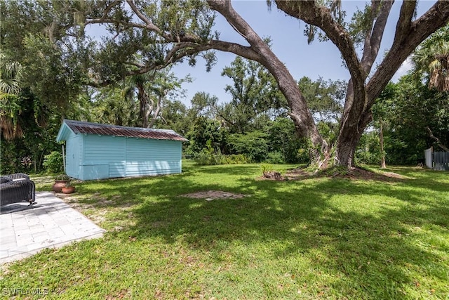 3475 Edgewood Ave, Fort Myers, FL 33916 - view of yard featuring a storage shed and a patio area