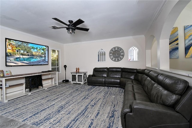 living room featuring ceiling fan and ornamental molding