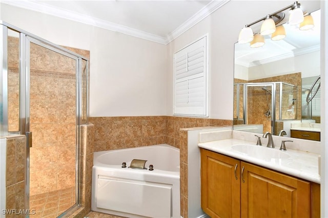 bathroom with ornamental molding, separate shower and tub, and vanity