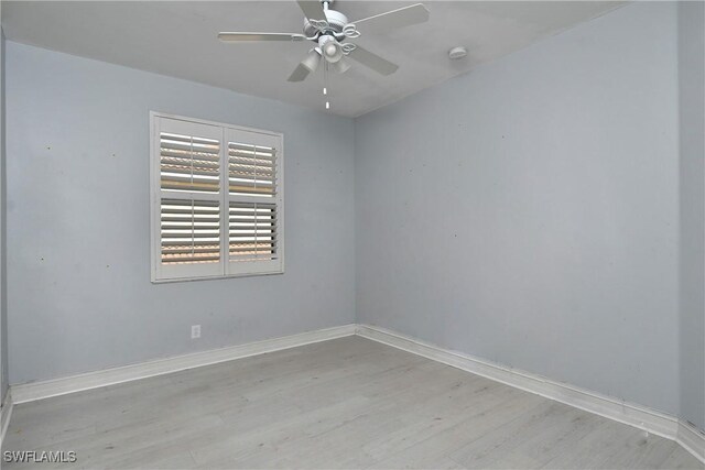 empty room with light hardwood / wood-style floors and ceiling fan