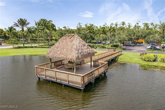 view of dock featuring a gazebo and a water view