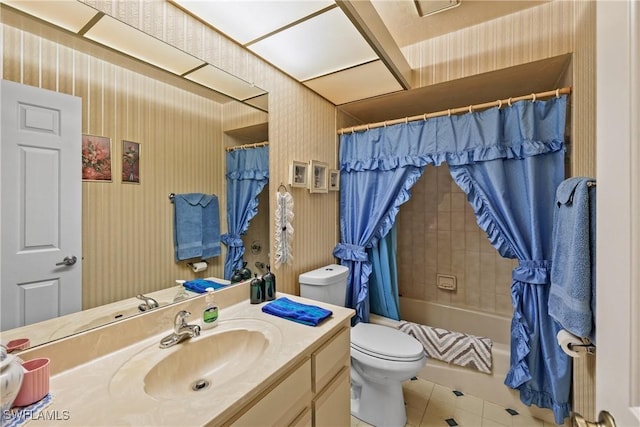 full bathroom featuring vanity, toilet, tile patterned flooring, and shower / bath combo with shower curtain