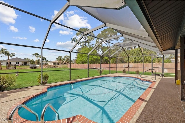 view of swimming pool featuring a patio area, a lawn, and glass enclosure