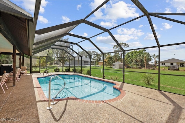 view of pool featuring a patio area, glass enclosure, and a lawn