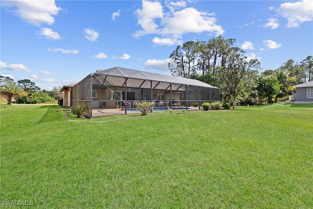 view of yard featuring glass enclosure and a patio area