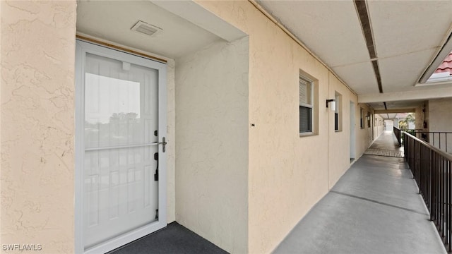 entrance to property featuring a balcony