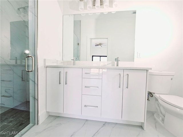 full bath with marble finish floor, a marble finish shower, double vanity, toilet, and a sink