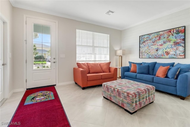 tiled living room featuring crown molding