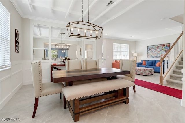 dining space with crown molding, built in shelves, and light tile patterned floors