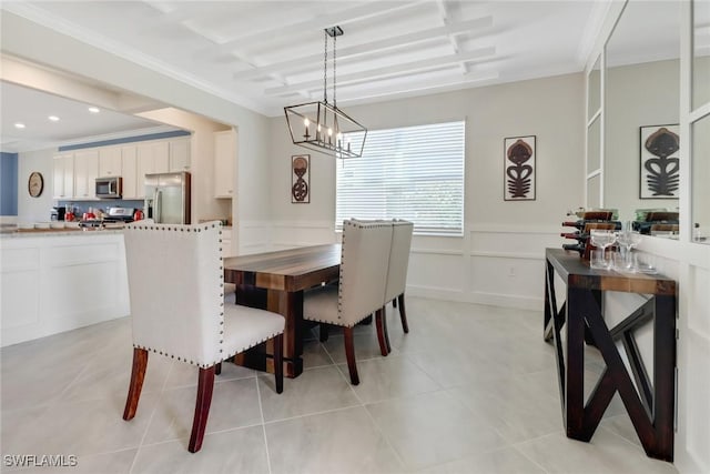 tiled dining space with an inviting chandelier and crown molding