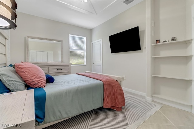 bedroom featuring light tile patterned floors