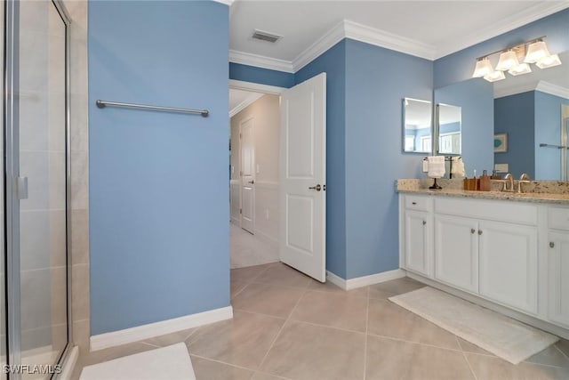 bathroom with a shower with shower door, vanity, crown molding, and tile patterned floors