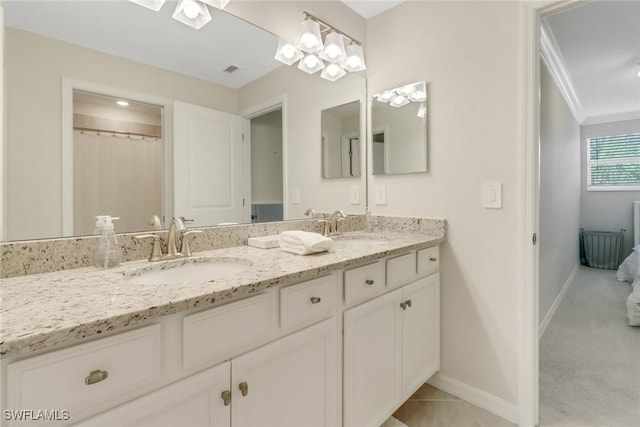 bathroom with vanity and crown molding