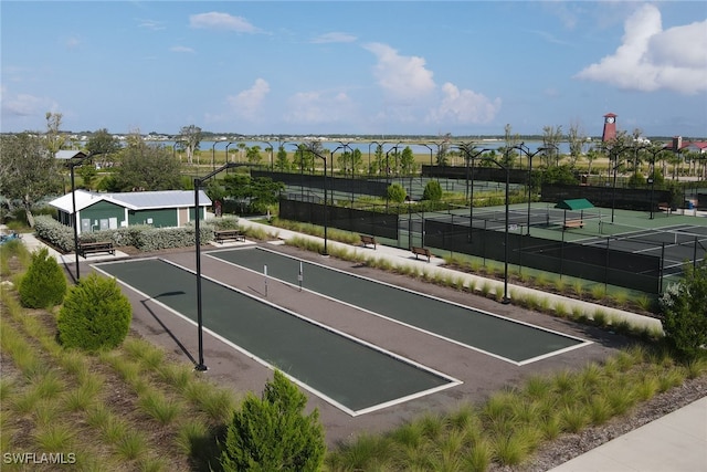 view of property's community with tennis court