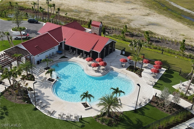 view of swimming pool featuring a patio