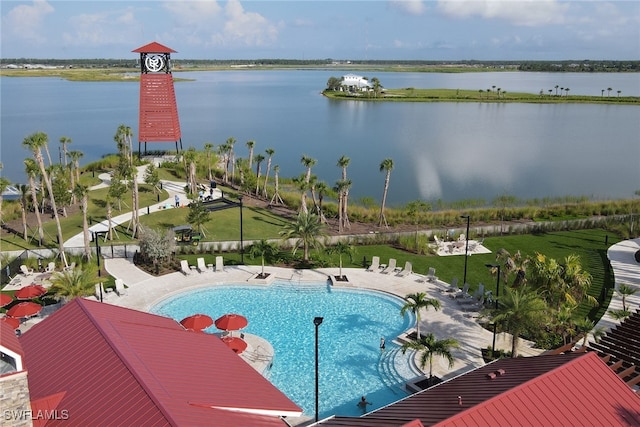 birds eye view of property with a water view